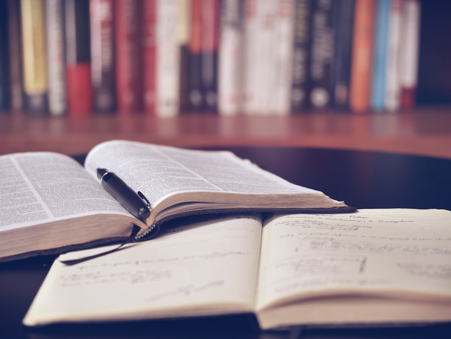Open textbook and handwritten study notes on a desk